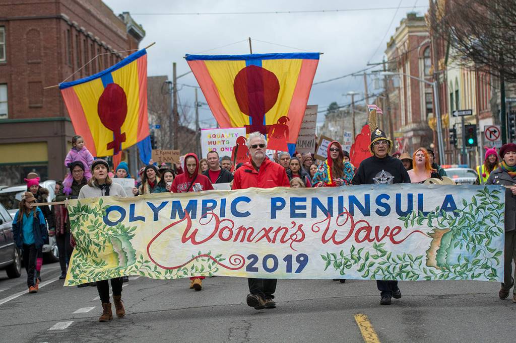 Police estimated that about 1,000 people participated in the third annual Olympic Peninsula Womxns Wave in Port Townsend on Sunday. (Jesse Major/Peninsula Daily News)