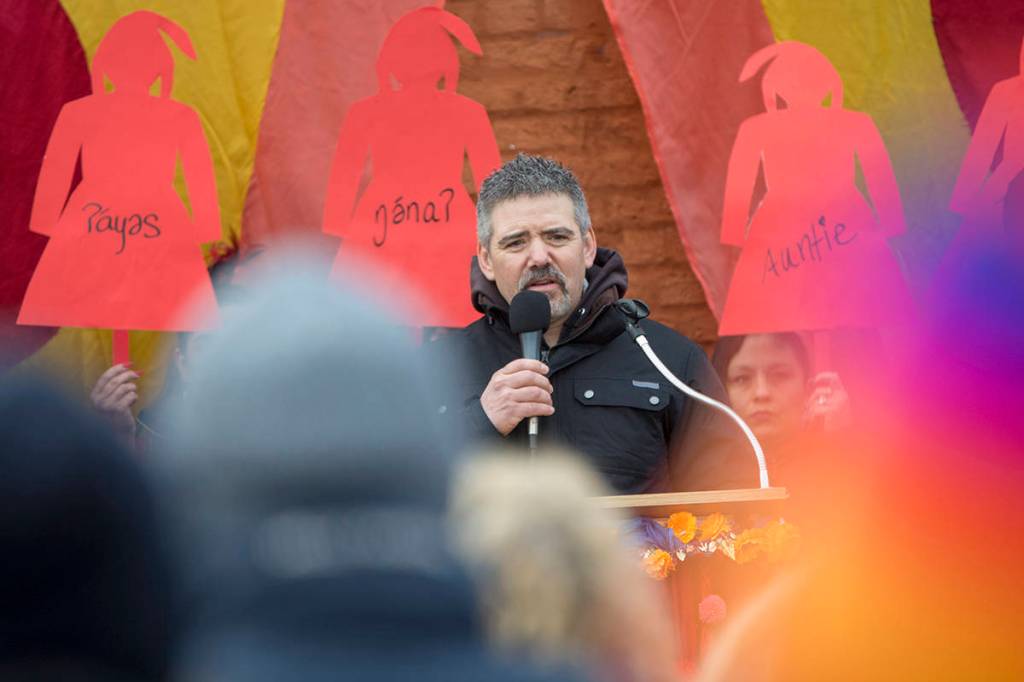 Kurt Grinnell of the Jamestown SKlallam Tribe speaks during the third annual Olympic Peninsula Womxns Wave in Port Townsend on Sunday. (Jesse Major/Peninsula Daily News)