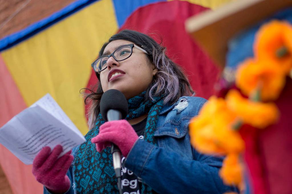 Abigail Vidals of Sequim speaks during the third annual Olympic Peninsula Womxns Wave in Port Townsend on Sunday. (Jesse Major/Peninsula Daily News)