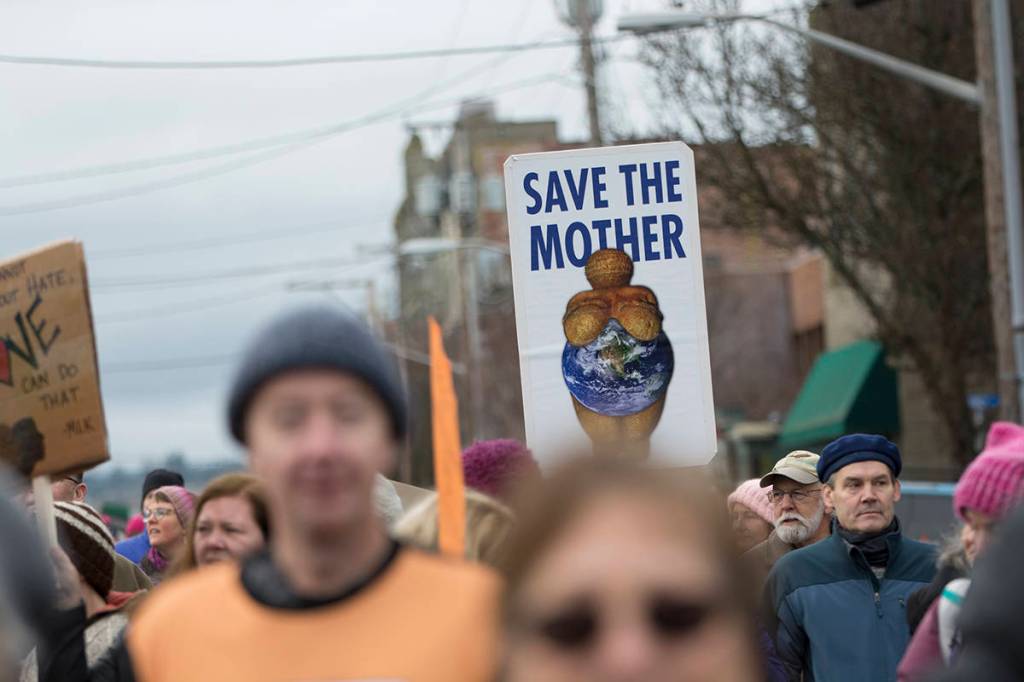 Police estimated that close to 1,000 people attended the third annual Olympic Peninsula Womxns Wave in Port Townsend on Sunday. (Jesse Major/Peninsula Daily News)