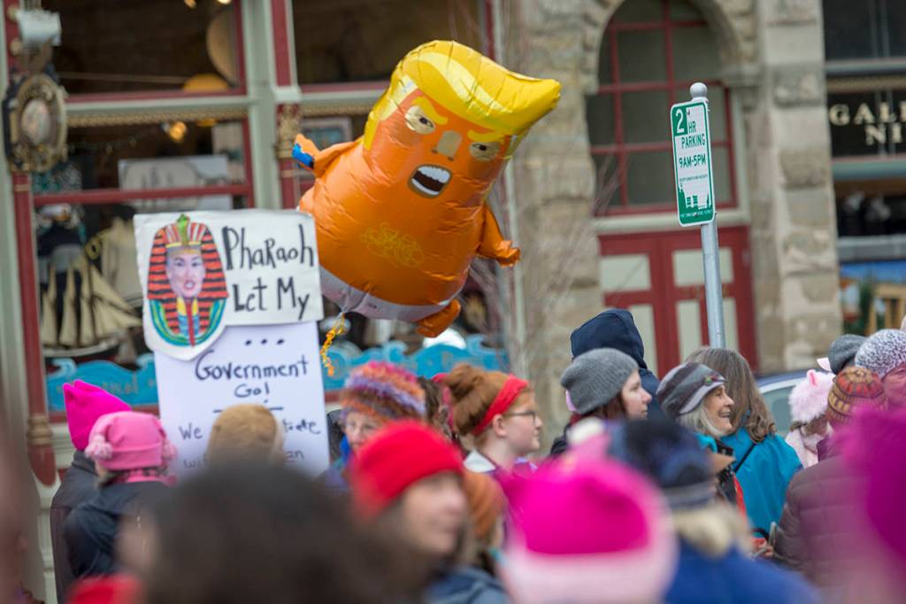 Police estimated that close to 1,000 people attended the third annual Olympic Peninsula Womxns Wave in Port Townsend on Sunday. (Jesse Major/Peninsula Daily News)