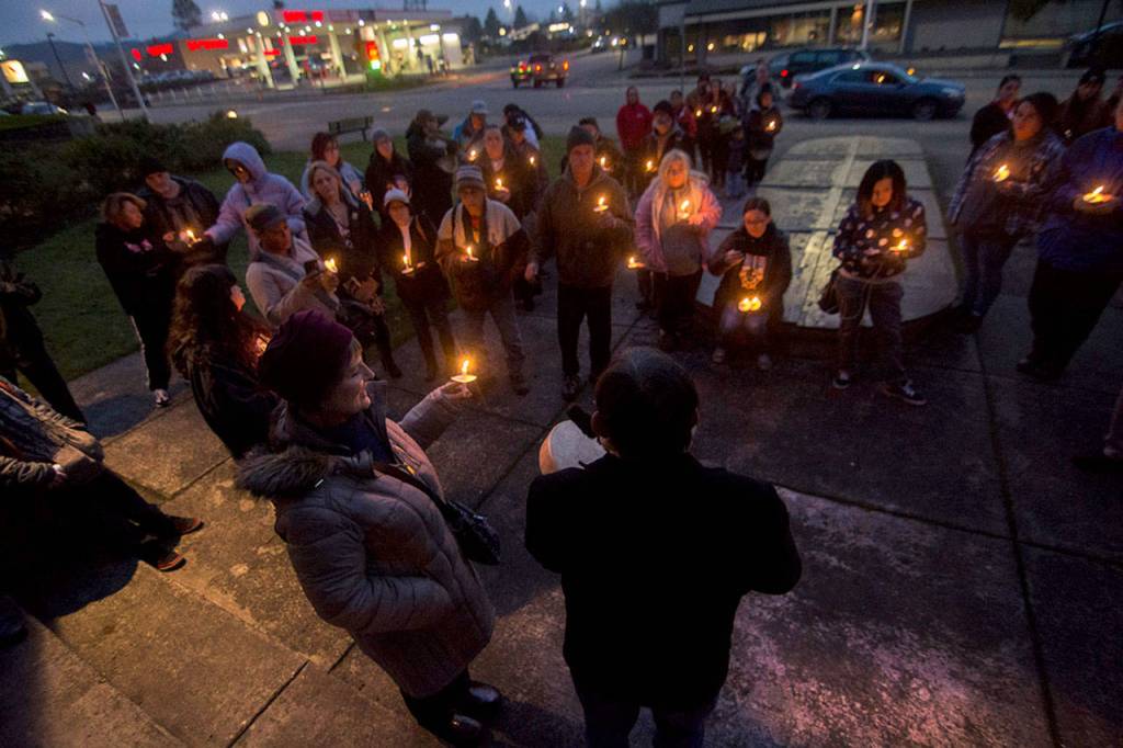 People gather Monday evening at Veterans Memorial Park in Port Angeles to mourn the death of Valerie Claplanhoo, who was killed in Sequim on Jan. 2. (Jesse Major/Peninsula Daily News)