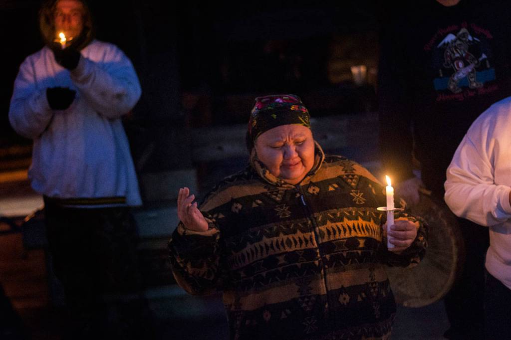 Thelma Lawrence of the Lower Elwha Klallam Tribe sings during a vigil for Valerie Claplanhoo Monday evening. (Jesse Major/Peninsula Daily News)