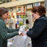 Photos by <strong>Matthew Nash</strong>/Olympic Peninsula News Group                                Jenna Ziogas, education coordinator for the Dungeness River Audubon Center, and Gabrielle Genhart-Stiehler, an AmeriCorps volunteer, wrap a mounted snow owl in a plastic bag prior to placing it in a freezer truck Thursday to prevent drugstore beetles from spreading onto it and other taxidermy animals in the center.