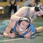 Keith Thorpe/Peninsula Daily News Port Angeles Daniel Basden, top, grapples with Olympics Robert Haugen in the 120 lb. weight class on Thursday at Port Angeles High School.