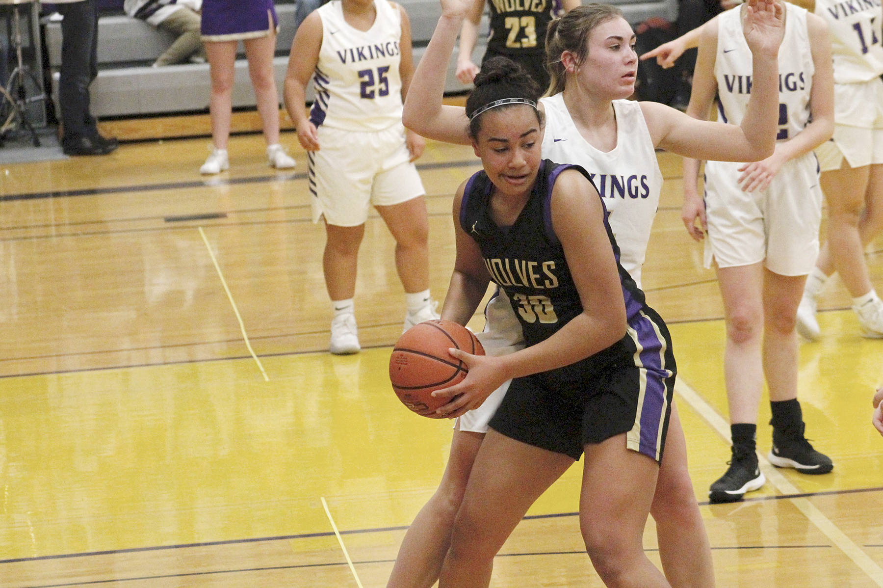 <strong>Mark Krulish</strong>/Kitsap News Group                                Sequims Jayla Julmist, with ball, is guarded by North Kitsaps Maddie Pruden.