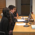 Orion Olsen, middle, testifies in favor of Senate Bill 5324 on behalf of the Mockingbird Society. In his testimony, Olsen spoke of the importance of public school faculty being educated on the resources available to homeless youth. Samie Iverson, left, and Katara Jordan also testified in favor of the bill, one that would widen accessibility of grants for homeless children in Washington state. (Emma Scher/WNPA Olympia News Bureau)