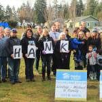 Community members gather together to commemorate breaking ground on two new homes in Port Angeles for two local families. (Habitat for Humanity of Clallam County)
