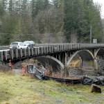 Cars are driven across the U.S. Highway 101 bridge over the Elwha River west of Port Angeles on Saturday. State transportation officials will brief the Port Angeles City Council and the public Tuesday about plans to replace the aging span. (Keith Thorpe/Peninsula Daily News)