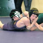Keith Thorpe/Peninsula Daily News Port Angeles Carlos Rodriguez, top, grapples with Sequims Trevin Oakes in the 106 lb. weight class during Saturdays 2A Olympic League Sub-Regionals at Port Angeles High School. Rodriguez went on to win the bout.