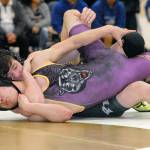 Keith Thorpe/Peninsula Daily News Sequims Zachery Koch, front, takes on Port Angeles Jackson Larson in the 145 lb. weight class in a semi-final round of the 2A Olympic League Sub-Regionals at Port Angeles High School on Saturday. Larson was victorious in the bout.