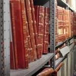 Bound volumes are county records stored in the State Archives building. Records have been damaged by water, but none were completely lost in the incidents. (Emma Scher/WNPA Olympia News Bureau)