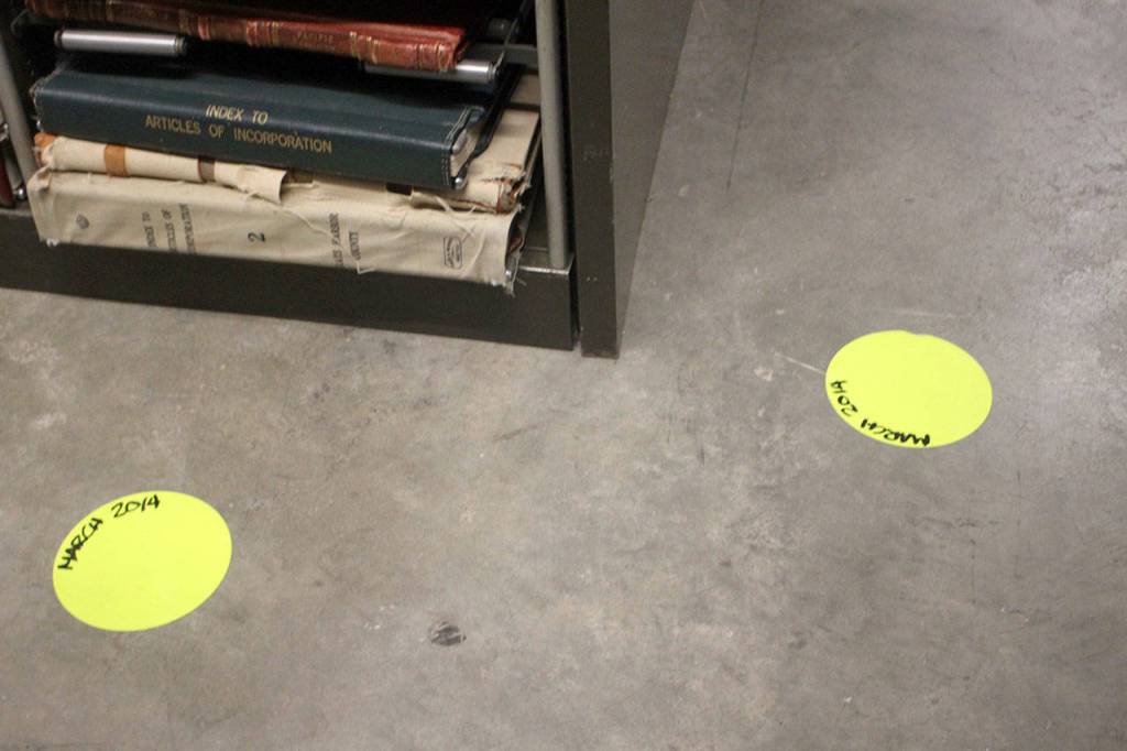 Dots mark areas where piping has leaked in the past. According to state Secretary of State Kim Wyman, the markers are to show where to put the buckets if leakages occur again. (Emma Scher/WNPA Olympia News Bureau)