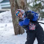 Lindsey Mike reacts after being hit with a snowball at a community snowball fight in Port Angeles on Sunday. (Jesse Major/Peninsula Daily News)
