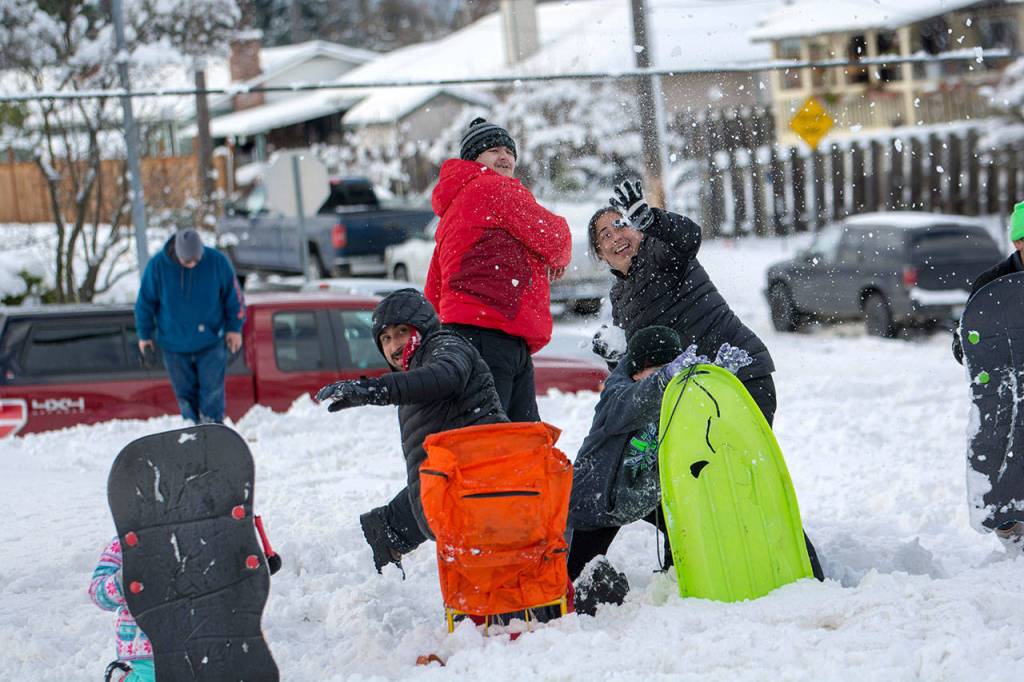 Scenes from the community snowball fight in Port Angeles on Sunday. (Jesse Major/Peninsula Daily News)