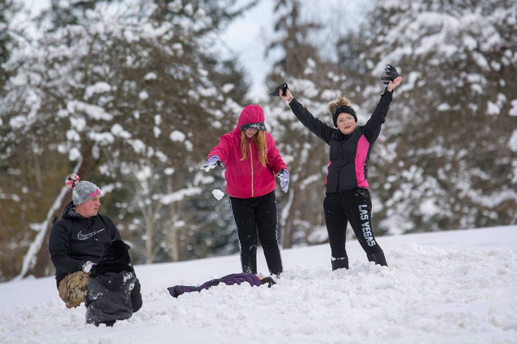 Scenes from the community snowball fight in Port Angeles on Sunday. (Jesse Major/Peninsula Daily News)