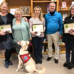 Crescent School District grant awardees, from left, are teacher Nancy McHenry, board President Lora Brabant, teacher Barb Silva, Superintendent Dave Bingham and teacher Kathryn Middlestead. In front is service dog Daisy.