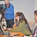 The PASD team prepares to deliver testimony with only 60 seconds allowed for each speaker. The lights on the witness table indicate green for go, yellow for warning, then red for stop. From left are Abby Sanders, Hailey Robinson, speaking into the microphone, and Andrew Pena. (Patsene Dashiell/Port Angeles School District)