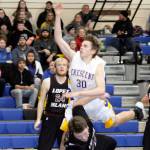 Crescents Brendan Bergstrom is called for a charging foul on this play. The Lopez Island Lobos won the loser out game 47-42. (Dave Logan/for Peninsula Daily News)