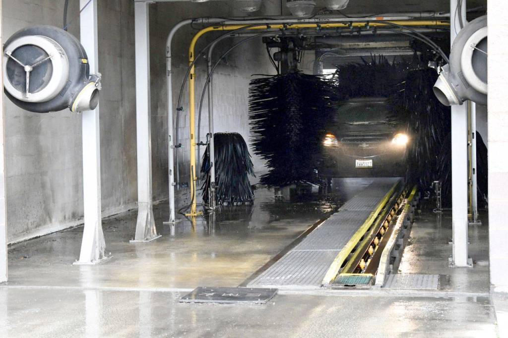 Now that the snow and ice are all but a memory, residents are paying attention to the storms deposits on their cars at The Car Wash on W. Sims Way in Port Townsend. (Jeannie McMacken/ Peninsula Daily News)