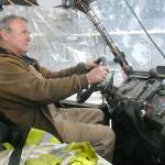 James Luna sits behind the wheel of his Honda off-road vehicle at his home in rural Sequim. (Keith Thorpe/Peninsula Daily News)
