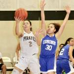 David Logan/for Peninsula Daily News Peninsulas Leilani Padilla, left, a freshman from Las Vegas, goes up for a laying after getting around Edmonds Analiyah Matthews, also a freshman from Las Vegas.