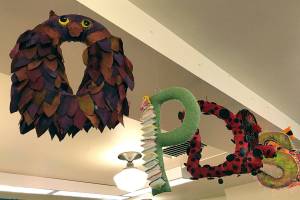 Singing welcome under floating library alphabet