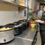 Lydia Stephan, 25, gets a plate of food on Wednesday afternoon at The Answer For Youth (TAFY), one of several organizations approved to receive funding from Clallam County. (Keith Thorpe/Peninsula Daily News)