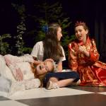 Alice (Kariya Johnson) converses with the Red Queen (Maggie van Dyken) just before the two queen opt to take a nap on her in Through the Looking-Glass. (Matthew Nash/Olympic Peninsula News Group)