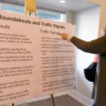 Jeanie Killmer of Port Ludlow discusses the merits of a roundabout at the Paradise Bay Road and state Highway 104 intersection with others who attended an open house Thursday afternoon. (Jeannie McMacken/Peninsula Daily News)