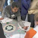 Department of Transportation representative Joseph Perez explains how traffic would flow through a recommended roundabout at the west end of the Hood Canal Bridge during an informational open house Thursday in Port Ludlow. (Jeannie McMacken/Peninsula Daily News)