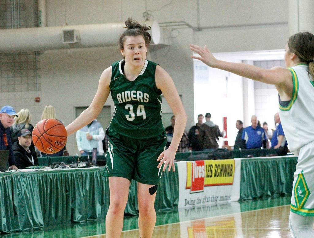 <strong>Mark Krulish</strong>/Kitsap News Group                                 Port Angeles Jaida Wood, left, looks up the court during the Roughriders state tournament loss to Lynden on Friday at the Yakima SunDome.