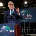 (Ted S. Warren/The Associated Press)                                Gov. Jay Inslee speaks Friday during a campaign event at AR Solar in Seattle.