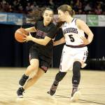 CeiJ Gagnon drives the ball against ACHs Sarah Bradshaw in the girls 1B third-place game Saturday in Spokane. Gagnon scored 12 points as the Red Devils won 67-56 to finish third, the highest girls finish ever at state. (Chris Johnson/for Peninsula Daily News)