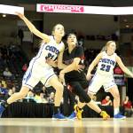 Neah Bays Patience Swan battles with Coltons Emily Schultheis for rebounding position in the girls Class 1B State Basketball Semifinals in Spokane on Friday. Also in on the play is Coltons Jordyn Moehrle. Colton won the game 83-38, sending Neah Bay to the third-place game. (Chris Johnson/for Peninsula Daily News)
