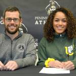 Peninsula College womens soccer head coach Kanyon Anderson and player Halle Watson at Watsons signing ceremony last week. The Peninsula College defensive back will play next year for the University of San Francisco.