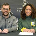 Peninsula College womens soccer head coach Kanyon Anderson and player Halle Watson at Watsons signing ceremony last week. The Peninsula College defensive back will play next year for the University of San Francisco.