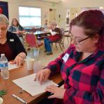Lorraine Ford, back left, is an Olympic Peninsula Arts Association member and watercolor artist who invited Michelle Sparrow, front right, to attend OPAAs monthly member meeting. The two women practice sketching animals in an art demonstration by Carolyn Guske. (Erin Hawkins/Olympic Peninsula News Group)