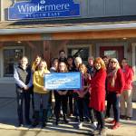 Kathy Suta of Sequim Community Aid accepts a $1,000 donation from Windermere Real Estate brokers in Sequim. Pictured, from left, are Alan Burwell, Kylie Walters, Marcee Medgin, Carol Dana, Jessica Warriner, Andrew Bradshaw, Dianna DaSilva, Dave Sharman, Cathy Reed, Joel Miller, Kathy Suta, Dollie Sparks, Jody McLean and Sheryl Payseno Burley.