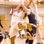 Jay Cline Peninsulas Olivia Williams, left and Kameron Bowen, right, battle with Wenatchee Valleys Cariann Kunkell for a rebound in the Pirates Elite Eight battle Sunday night. Wenatchee Valley won 87-75 thanks to a 21-3 run in the third quarter.