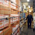 Earthquake preparedness advocate Jim Buck walks through a shipping container filled with food and community supplies at an undisclosed location near Joyce. (Keith Thorpe/Peninsula Daily News)