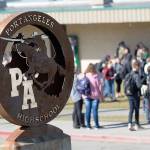 Students at Port Angeles High School wait for buses after school. The Port Angeles School District has sent notices to 18 staff members. (Jesse Major/Peninsula Daily News)