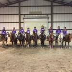 Sequim High Schools Washington State High School Equestrian Team prepares for their competition meets weekly at Freedom Farms indoor arena. Farm owners Mary Gallagher and Jerry Schmidt generously offer an evening to practice inside to the Port Angeles team, too. The Sequim team, from left, are Khelea Cloetens, Grace Niemeyer, Keri Tucker, Miranda Williams, Abby Garcia, Yana Hoesel, Abbi Priest, Lilly Thomas and Chloe VanProyen. (Katie Newton)