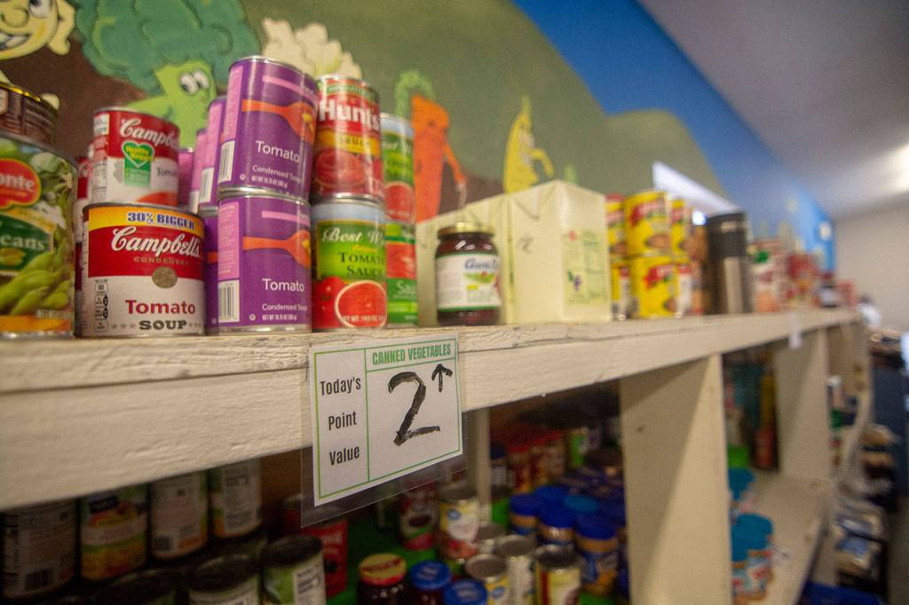 A sign shows that canned vegetables cost Port Angeles Food Bank clients 2 points. Each client is assigned points that they can use on the items that they want. (Jesse Major/Peninsula Daily News)