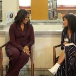 Former first lady Michelle Obama, left, chats with Lestraundra Alfred, founder of Balanced Black Girl podcast at a private book club event at the Tacoma Public Library on Sunday. (Olivia Sullivan/Federal Way Mirror)