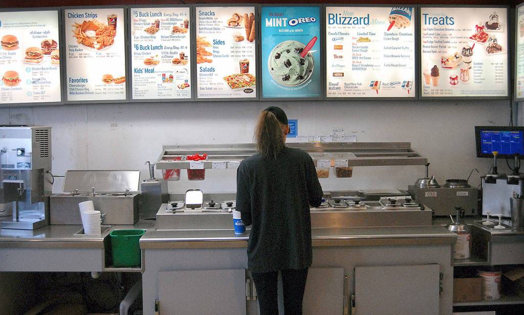 Dairy Queen employee Haylee Yockey prepares a frozen confection on the last day of business on Railroad Avenue in Port Angeles. (Keith Thorpe/Peninsula Daily News)