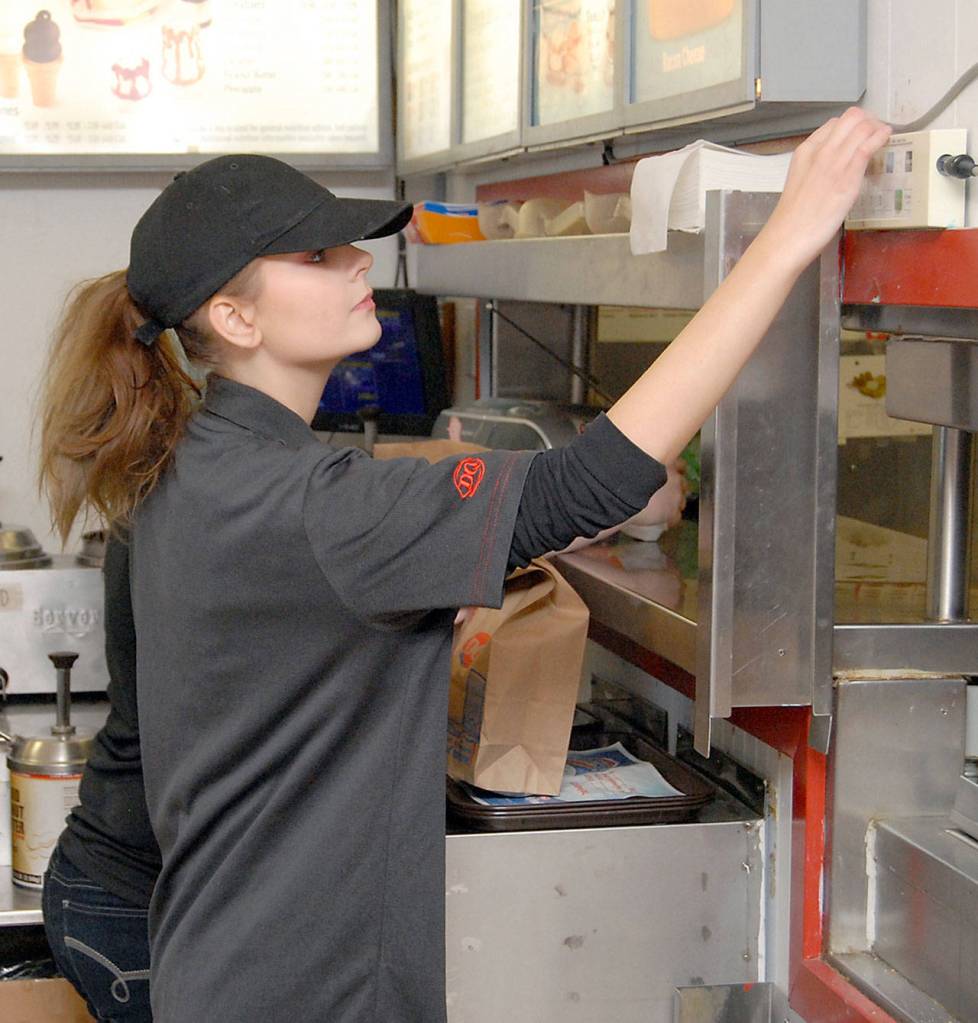 Dairy Queen employee Haylee Yockey checks a customer order on Tuesday in Port Angeles. (Keith Thorpe/Peninsula Daily News)