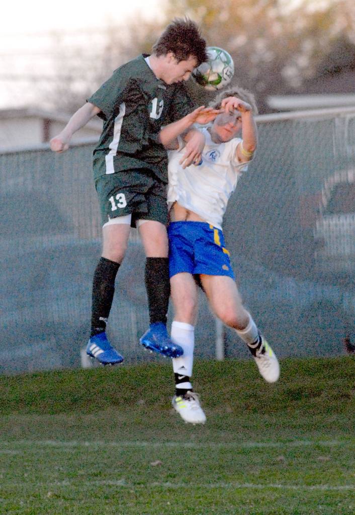 Keith Thorpe/Peninsula Daily News Port Angeles Stuart Methner, left, and Bremertons Ian Stuart battle for a header during the first half of Tuesdays match at Port Angeles Civic Field.
