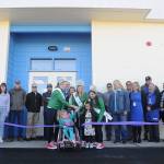 School representatives, community members and others celebrate the official opening of the Sequim School Districts new central kitchen with a ribbon-cutting. (Michael Dashiell/Olympic Peninsula News Group)