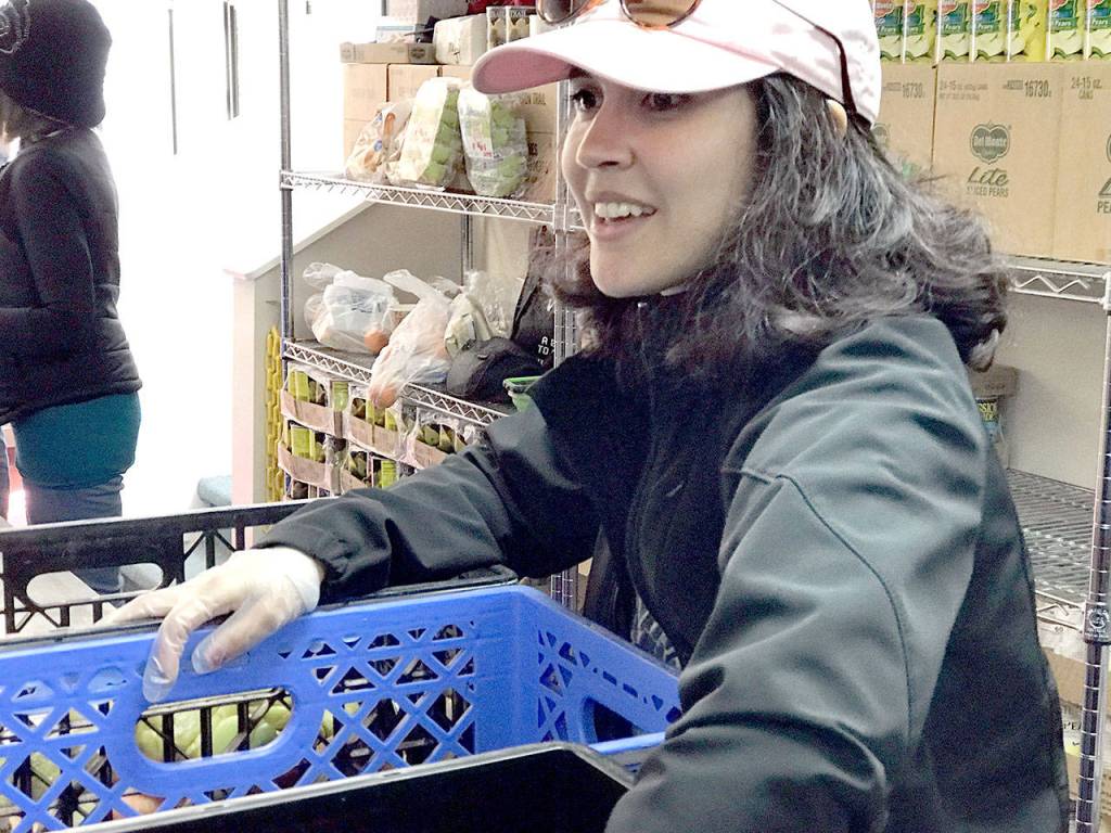 Food Lifeline Grocery Rescue program manager Sandra Largaespada came to Port Hadlock on Wednesday from Seattle to volunteer at the Tri-Area Food Bank. (Brian McLean/Peninsula Daily News)